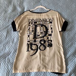 Blouse with cut on back. Two colors: beige and black